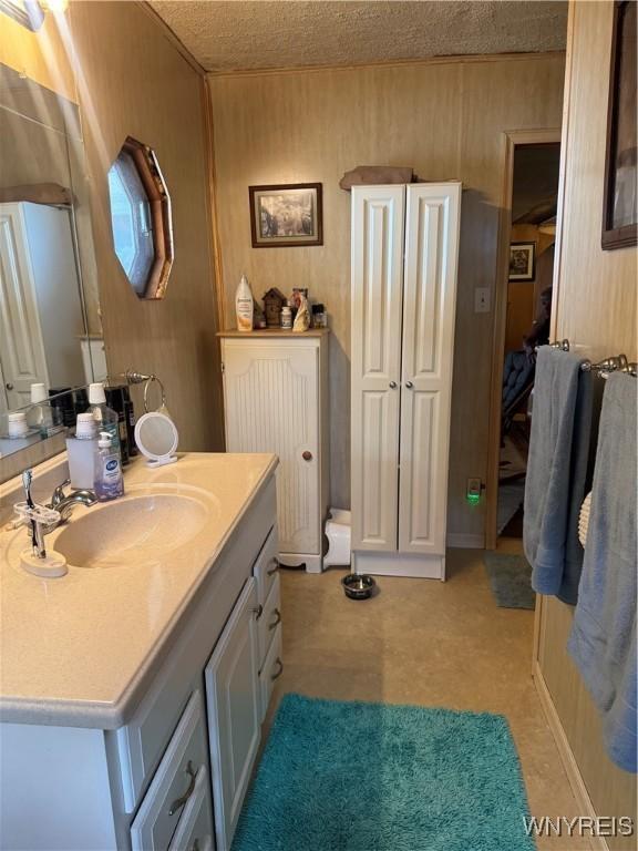 29 Church St, Royalton, NY 14105 - bathroom featuring vanity and a textured ceiling