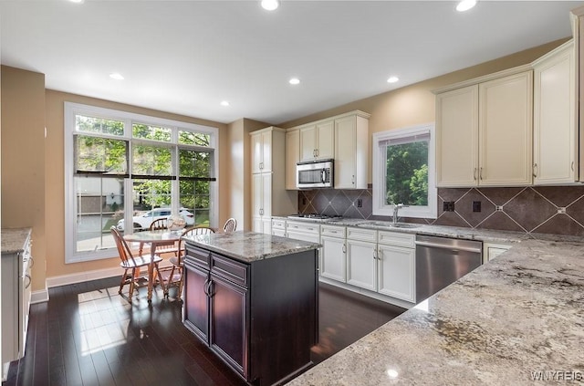 171 Harbridge Mnr, Amherst, NY 14221 - kitchen featuring stainless steel appliances, light stone counters, plenty of natural light, a center island, and recessed lighting