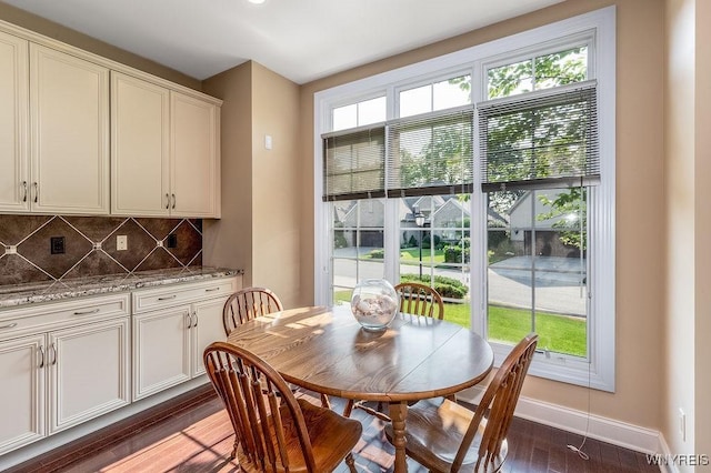 171 Harbridge Mnr, Amherst, NY 14221 - dining space featuring dark wood finished floors and baseboards