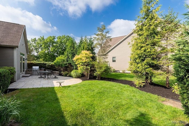 171 Harbridge Mnr, Amherst, NY 14221 - view of grassy yard featuring a patio