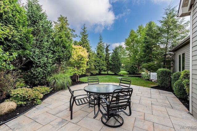 171 Harbridge Mnr, Amherst, NY 14221 - view of patio / terrace featuring outdoor dining area and view of scattered trees