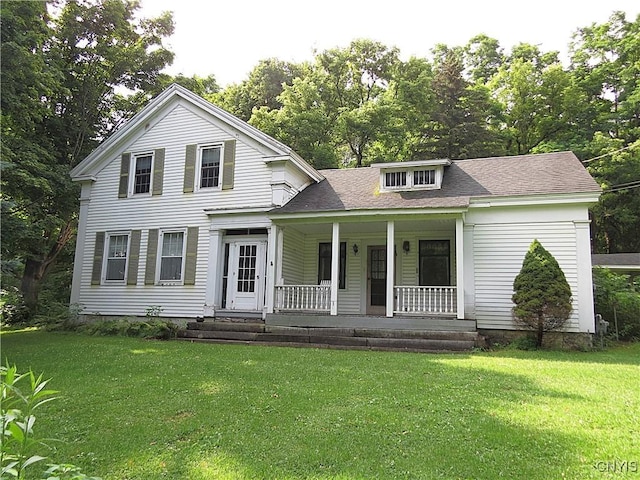 164 Kanzog Rd, German Flatts, NY 13407 - neoclassical / greek revival house with covered porch, a front lawn, a shingled roof, and view of scattered trees