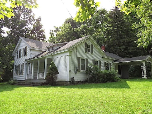 164 Kanzog Rd, German Flatts, NY 13407 - view of home's exterior featuring covered porch, a yard, and a chimney