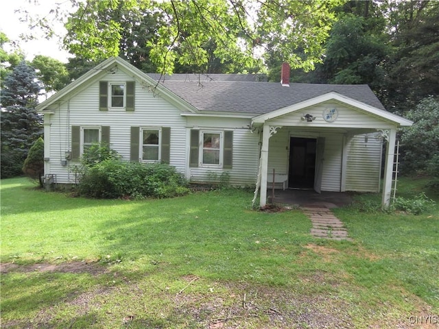 164 Kanzog Rd, German Flatts, NY 13407 - view of front of house with a chimney, a front yard, and roof with shingles