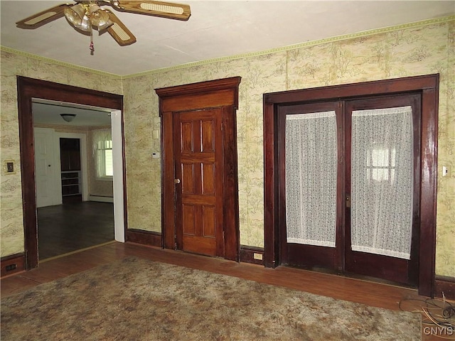 164 Kanzog Rd, German Flatts, NY 13407 - entrance foyer with wood finished floors, a ceiling fan, a baseboard heating unit, french doors, and crown molding