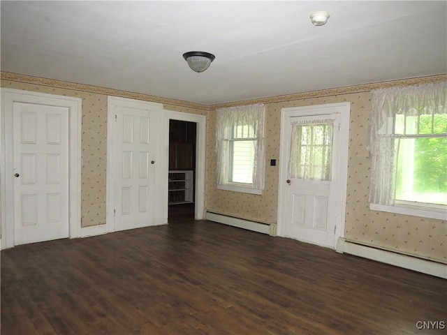 164 Kanzog Rd, German Flatts, NY 13407 - foyer entrance with baseboard heating, wallpapered walls, dark wood-style flooring, and healthy amount of natural light