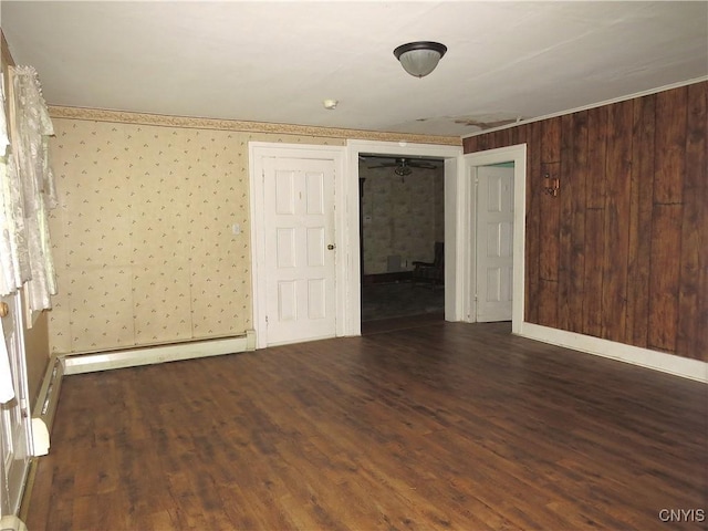 164 Kanzog Rd, German Flatts, NY 13407 - unfurnished room featuring wood finished floors, wallpapered walls, and a baseboard heating unit
