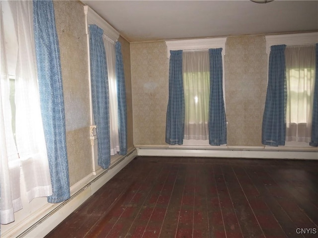 164 Kanzog Rd, German Flatts, NY 13407 - spare room featuring wood-type flooring, a baseboard heating unit, and healthy amount of natural light