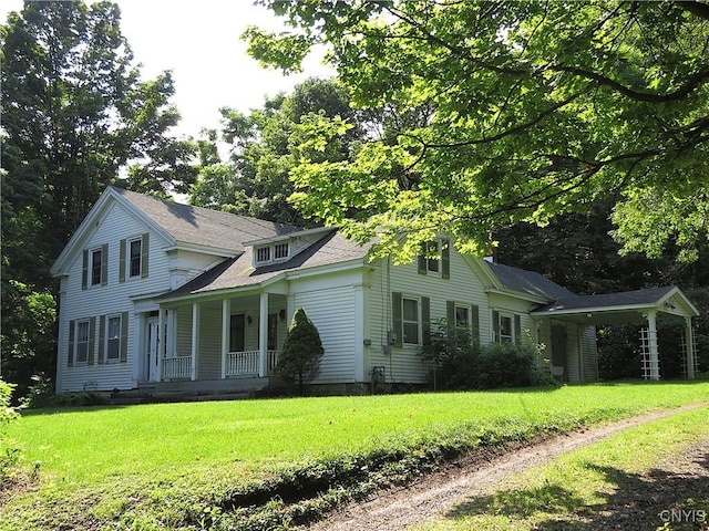 164 Kanzog Rd, German Flatts, NY 13407 - view of front of house featuring covered porch, a front lawn, and a shingled roof