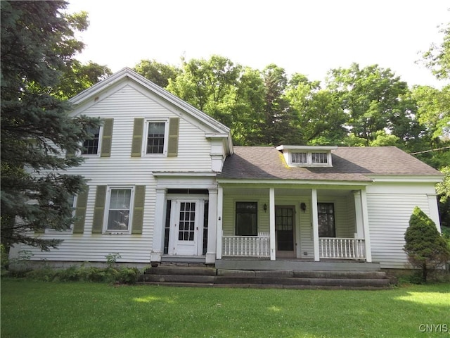 164 Kanzog Rd, German Flatts, NY 13407 - greek revival inspired property with a porch, a front lawn, and a shingled roof