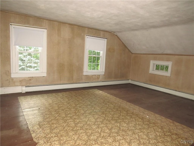 164 Kanzog Rd, German Flatts, NY 13407 - bonus room with vaulted ceiling, wood finished floors, wooden walls, and baseboard heating