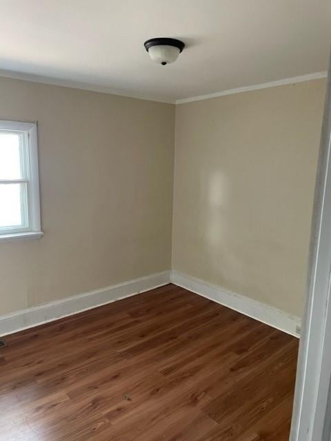1307 Lackawanna Ave, Elmira City, NY 14901 - unfurnished room featuring crown molding and dark wood-style flooring