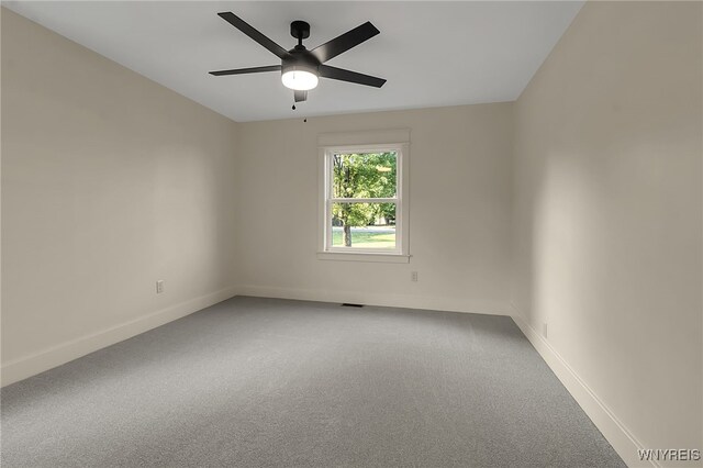 4221 Upper Mountain Rd, Cambria, NY 14132 - carpeted spare room featuring baseboards and a ceiling fan