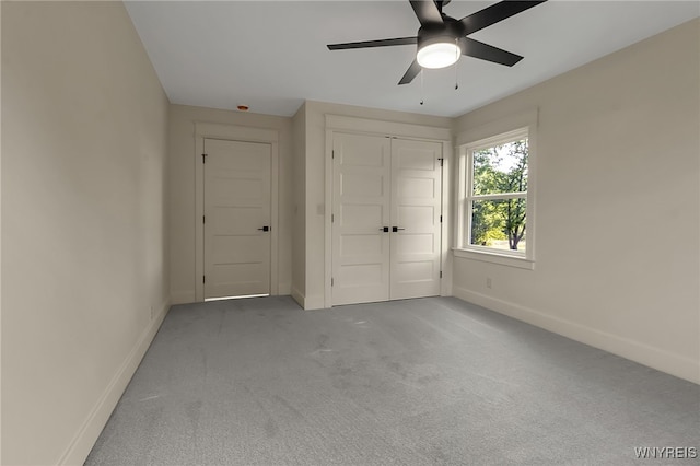 4221 Upper Mountain Rd, Cambria, NY 14132 - unfurnished bedroom featuring carpet, a closet, and a ceiling fan