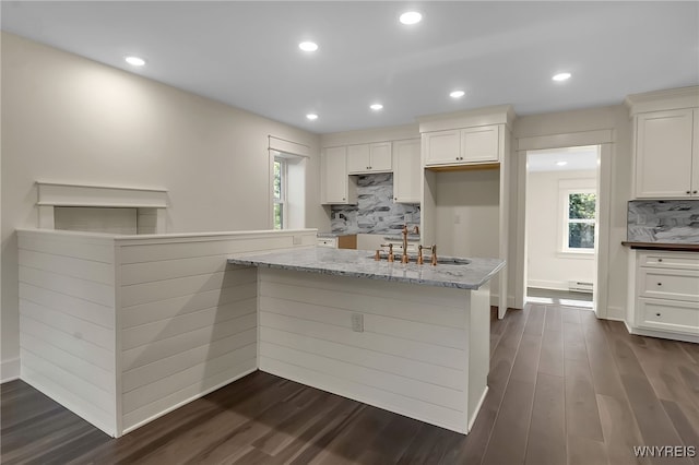4221 Upper Mountain Rd, Cambria, NY 14132 - kitchen featuring tasteful backsplash, dark wood-style flooring, white cabinets, light stone countertops, and recessed lighting
