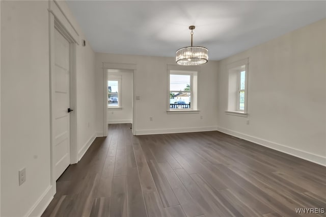 4221 Upper Mountain Rd, Cambria, NY 14132 - unfurnished dining area with plenty of natural light, dark wood-style floors, and a chandelier