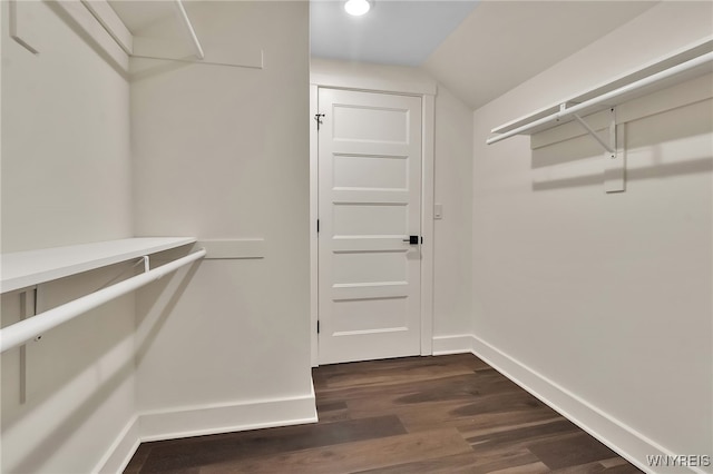 4221 Upper Mountain Rd, Cambria, NY 14132 - walk in closet with vaulted ceiling and dark wood-type flooring