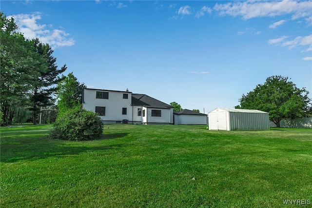 4221 Upper Mountain Rd, Cambria, NY 14132 - rear view of property with a yard and a shed