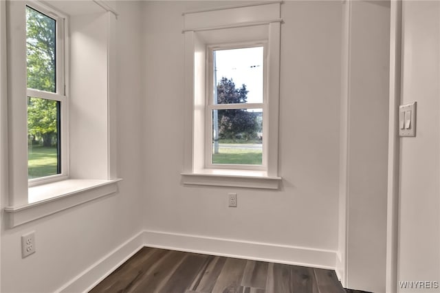 4221 Upper Mountain Rd, Cambria, NY 14132 - unfurnished room featuring dark wood finished floors and plenty of natural light