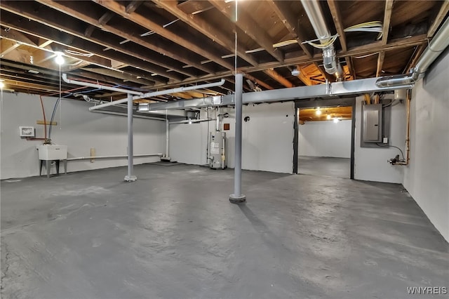 4221 Upper Mountain Rd, Cambria, NY 14132 - unfinished basement with electric panel and gas water heater