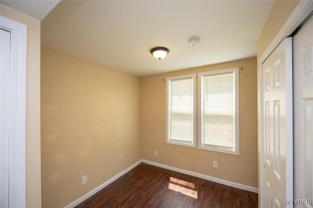 54 Tuxedo Pl, Buffalo, NY 14207 - unfurnished bedroom with dark wood-style floors and a closet