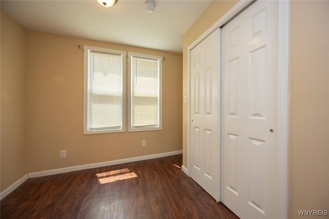 54 Tuxedo Pl, Buffalo, NY 14207 - unfurnished bedroom featuring dark wood finished floors and a closet