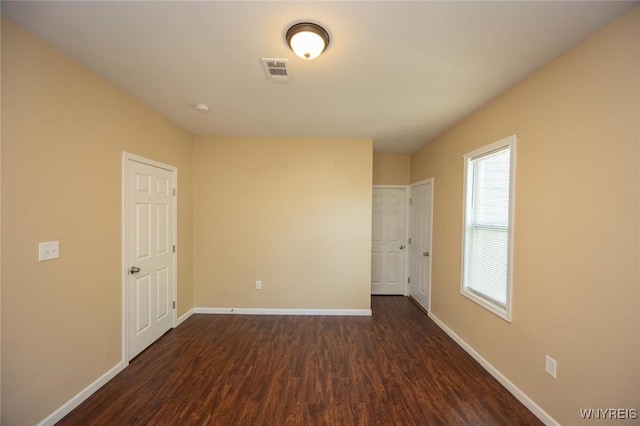 54 Tuxedo Pl, Buffalo, NY 14207 - unfurnished bedroom featuring dark wood finished floors and baseboards