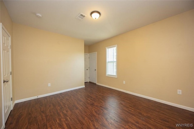 54 Tuxedo Pl, Buffalo, NY 14207 - unfurnished bedroom with dark wood-style floors and baseboards