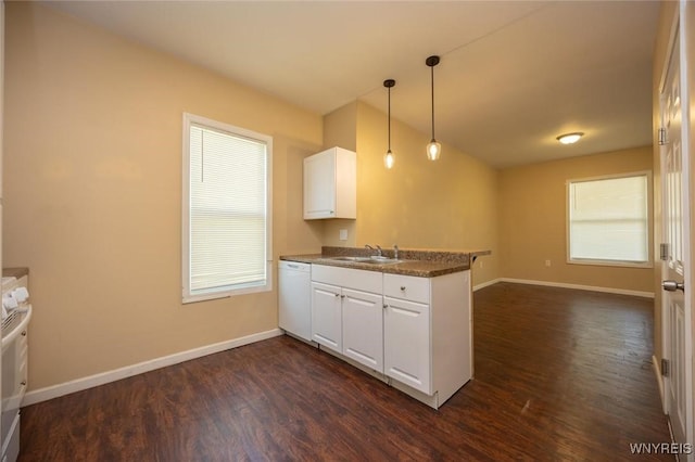 54 Tuxedo Pl, Buffalo, NY 14207 - kitchen featuring white dishwasher, a peninsula, dark wood-style floors, white cabinets, and dark countertops