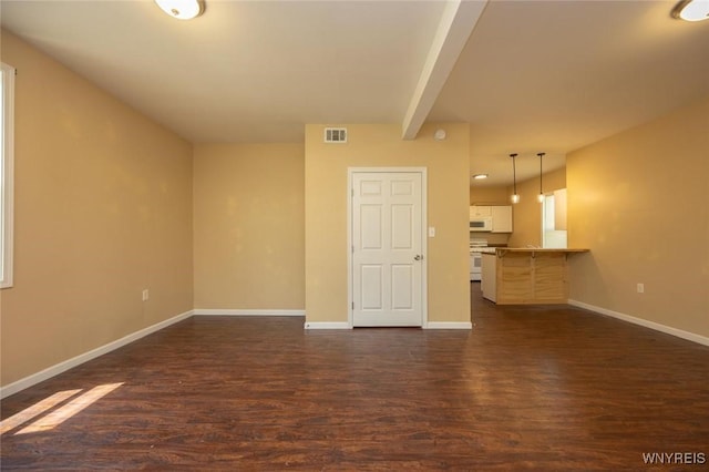 54 Tuxedo Pl, Buffalo, NY 14207 - unfurnished living room with dark wood-style floors and beamed ceiling