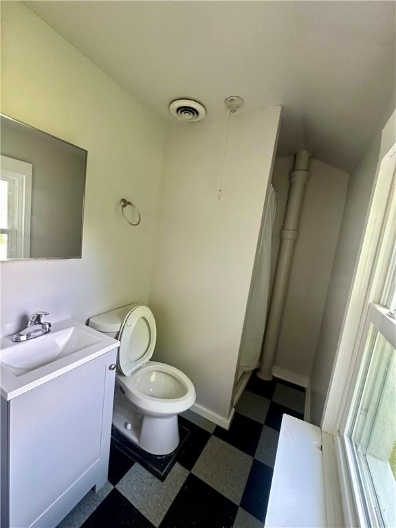 50 Saratoga Ave, Rochester, NY 14608 - full bath featuring tile patterned floors and vanity