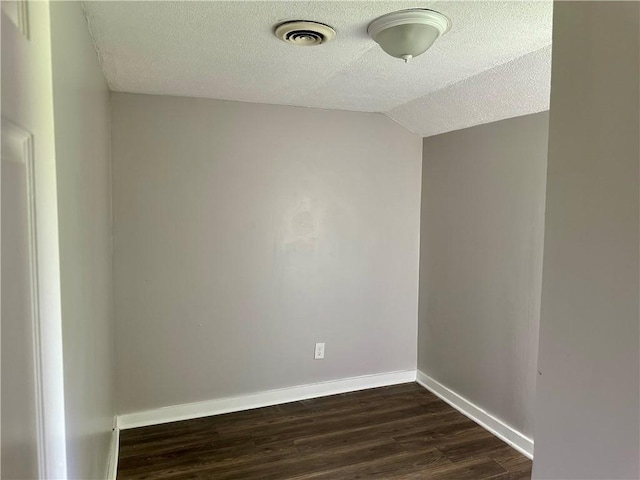 50 Saratoga Ave, Rochester, NY 14608 - empty room with a textured ceiling, dark wood-style floors, and lofted ceiling