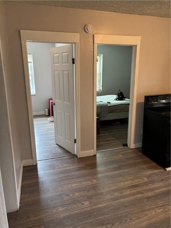 50 Saratoga Ave, Rochester, NY 14608 - hallway featuring washer / clothes dryer and dark wood-type flooring