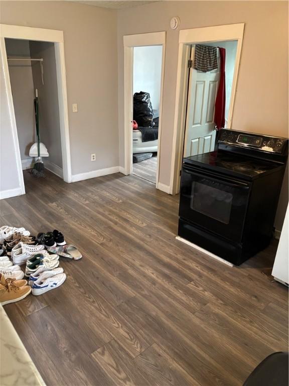 50 Saratoga Ave, Rochester, NY 14608 - living room with dark wood-style floors and baseboards