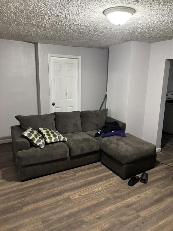 50 Saratoga Ave, Rochester, NY 14608 - living room featuring wood finished floors and a textured ceiling