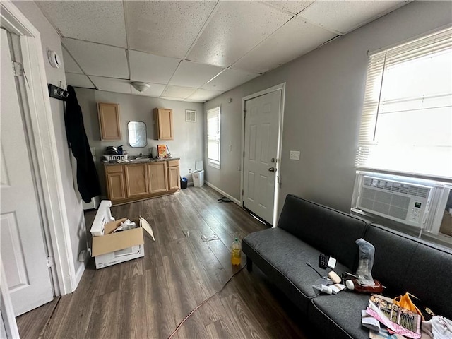 50 Saratoga Ave, Rochester, NY 14608 - living area with a drop ceiling, dark wood-type flooring, and cooling unit