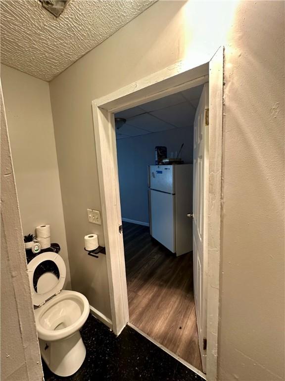 50 Saratoga Ave, Rochester, NY 14608 - bathroom featuring toilet and baseboards