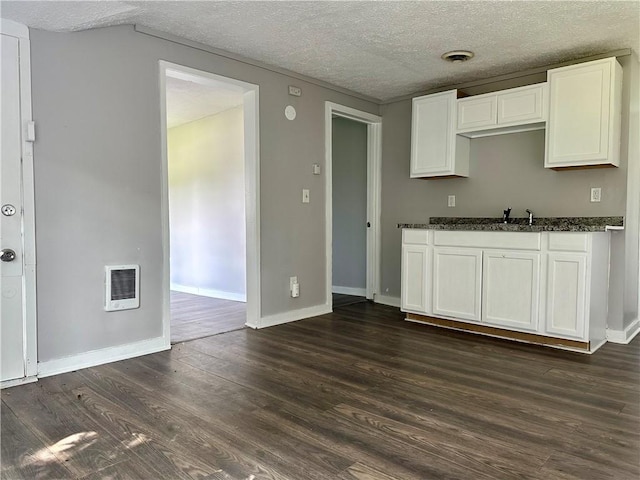 50 Saratoga Ave, Rochester, NY 14608 - kitchen featuring dark wood-style flooring, white cabinets, a textured ceiling, and dark stone countertops