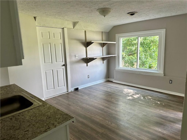 50 Saratoga Ave, Rochester, NY 14608 - unfurnished dining area featuring a textured ceiling and dark wood finished floors