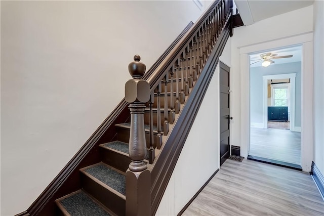 26 Fountain St, Rochester, NY 14620 - stairs featuring wood finished floors and baseboards