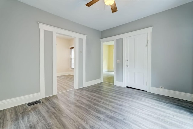 26 Fountain St, Rochester, NY 14620 - unfurnished bedroom with wood finished floors, a ceiling fan, and a closet