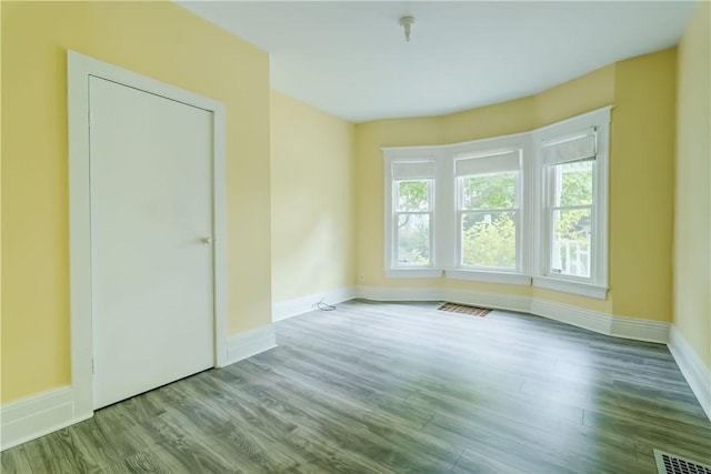 26 Fountain St, Rochester, NY 14620 - spare room featuring wood finished floors and baseboards