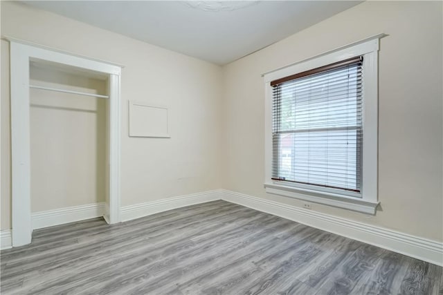 26 Fountain St, Rochester, NY 14620 - unfurnished bedroom featuring wood finished floors and a closet