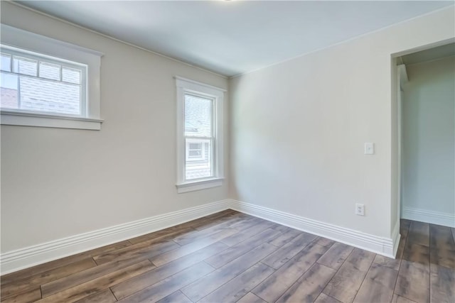26 Fountain St, Rochester, NY 14620 - empty room featuring dark wood-style flooring and baseboards