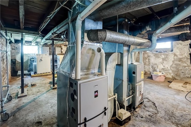 26 Fountain St, Rochester, NY 14620 - utility room featuring washer / clothes dryer and heating unit