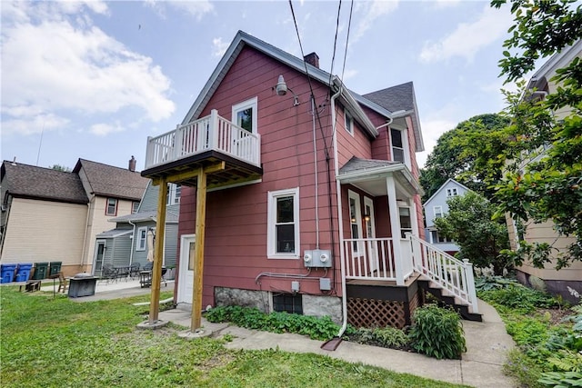 26 Fountain St, Rochester, NY 14620 - view of home's exterior featuring a balcony, a lawn, and a patio area