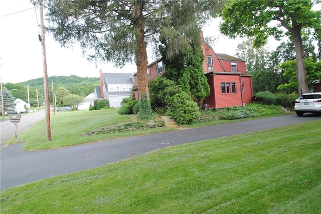 11 Elmwood Ave, Hornellsville, NY 14843 - view of home's exterior with a lawn