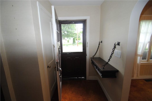 11 Elmwood Ave, Hornellsville, NY 14843 - entryway featuring dark colored carpet and arched walkways
