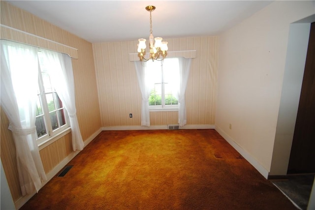 11 Elmwood Ave, Hornellsville, NY 14843 - empty room featuring a chandelier and carpet flooring
