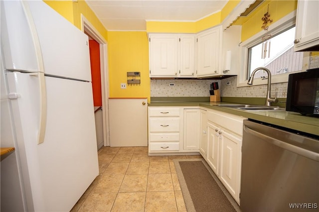 150 Collins Ave, West Seneca, NY 14224 - kitchen featuring freestanding refrigerator, dishwasher, tasteful backsplash, light tile patterned flooring, and white cabinetry